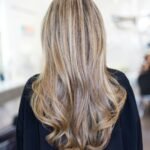 Woman with a voluminous butterfly cut