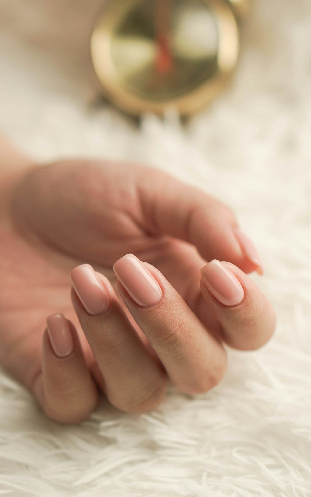 Nail Shapes: The Ultimate Guide to 11 Nail Shapes and How to Choose the Best One for Your Hands 2 Polished nails showing a rounded almond nail shape